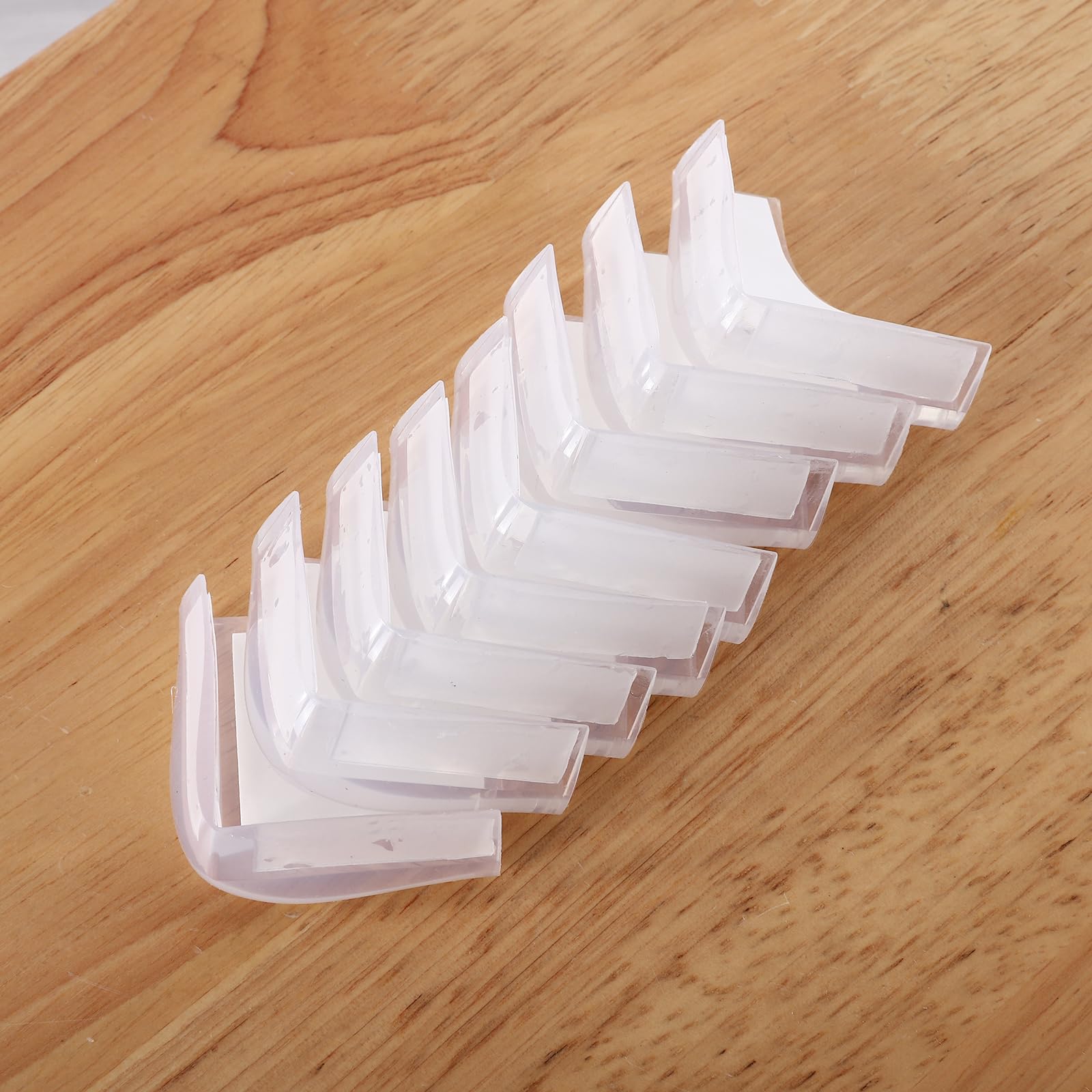 Angloria corner protector on wood table edge protects from bumps