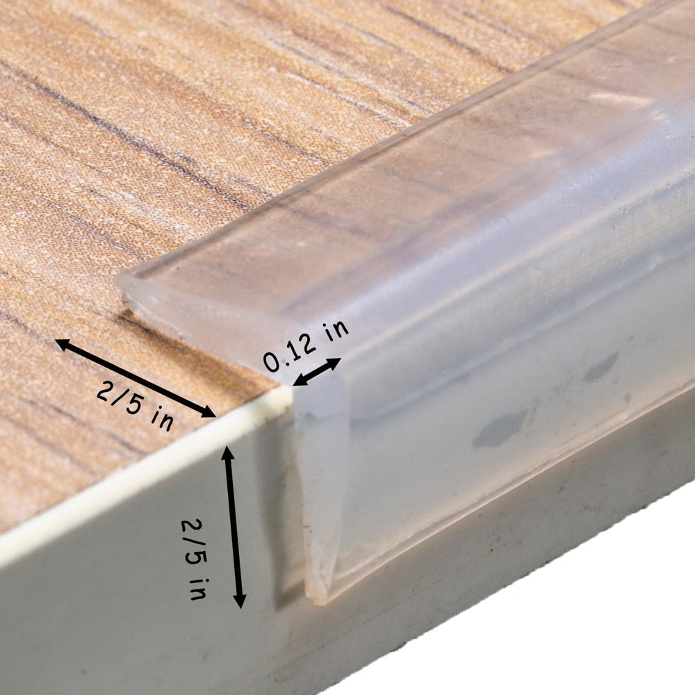 Angloria edge protector installed on a table corner provides gentle impact reduction.