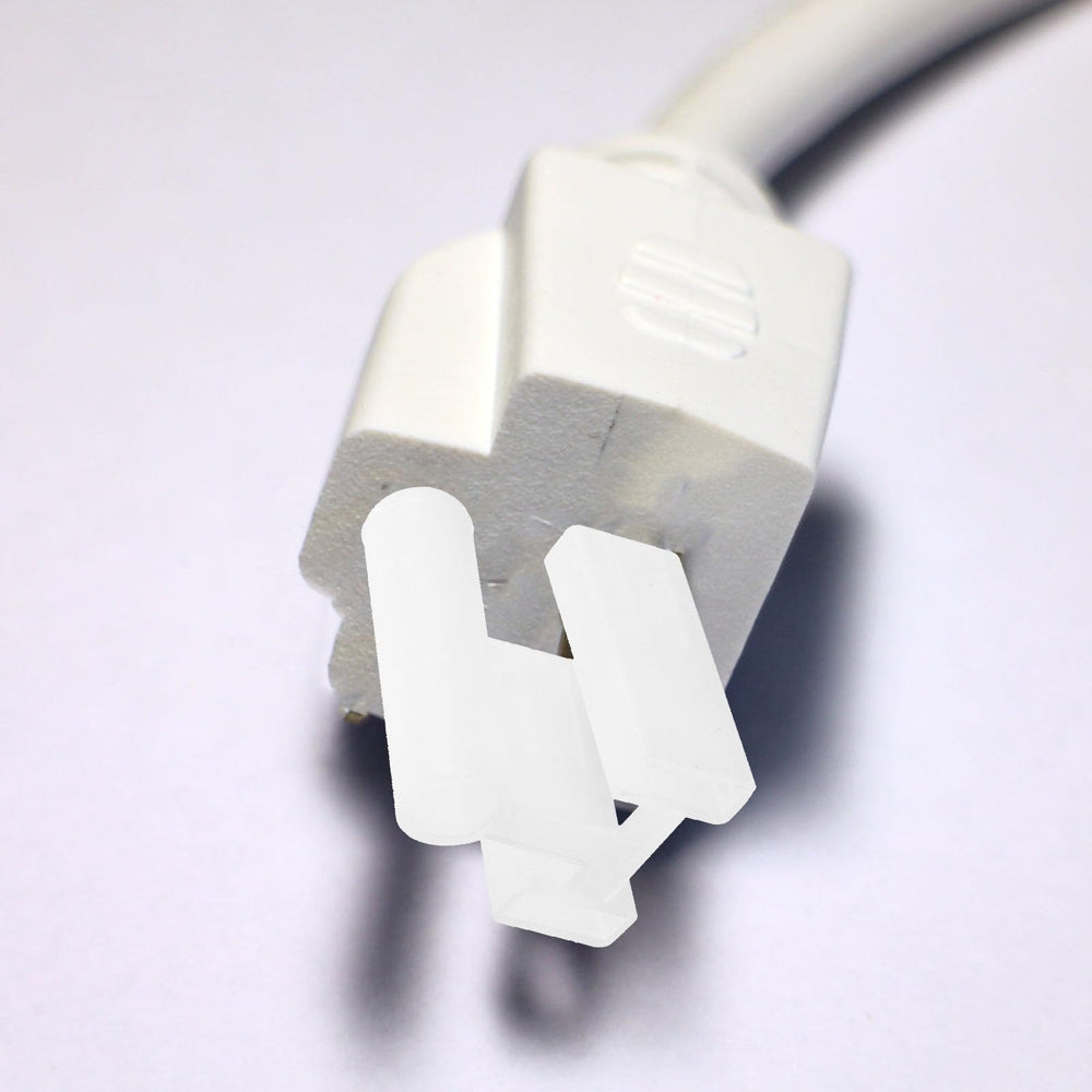 Angoily outlet cap in home office reduces hazards from exposed outlets.
