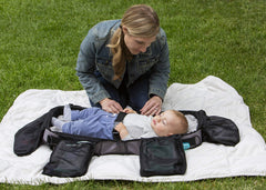 Anna & Eve bag attached to a stroller for hands-free baby gear during outings.