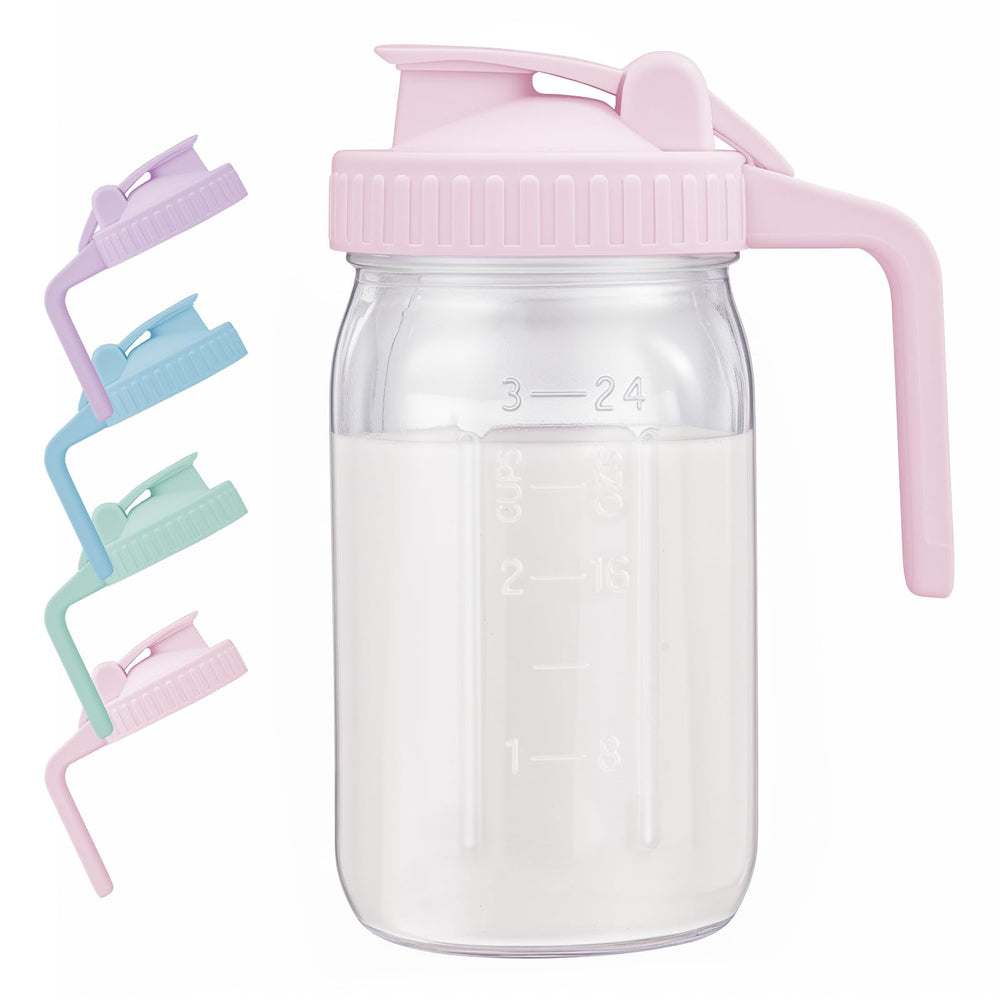 AoeJarry pink glass pitcher with lid on bright countertop.