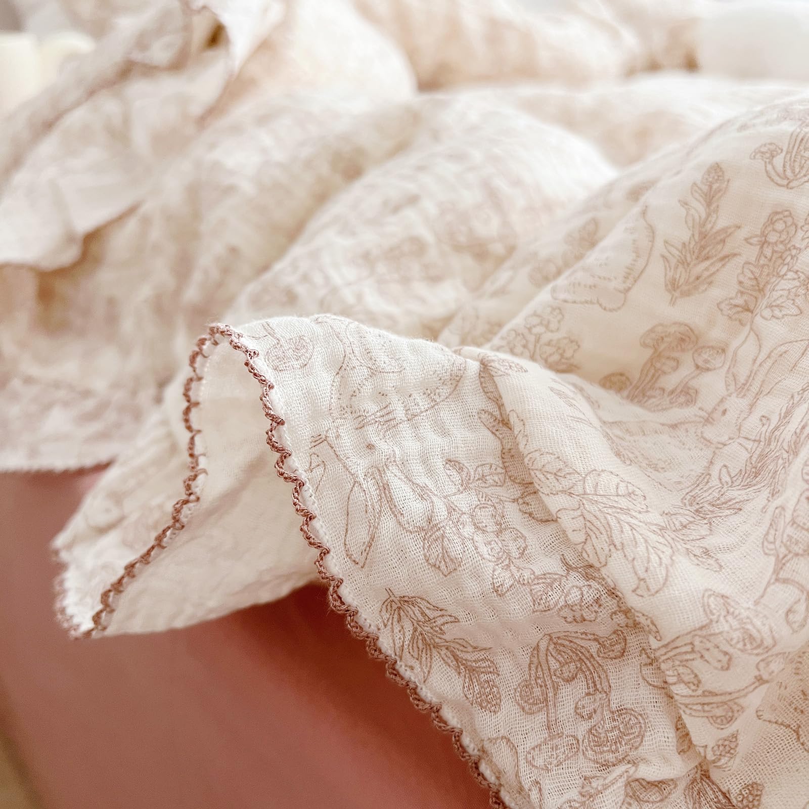 AOJIM floral and animal print pattern detail on duvet cover, adds warmth to nursery.