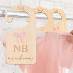 AOQURE bohemian-inspired divider complements neutral nursery decor while sorting sizes.