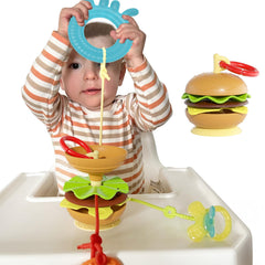 Aprilwolf hamburger suction cup base keeps toys secure on high chair surfaces.