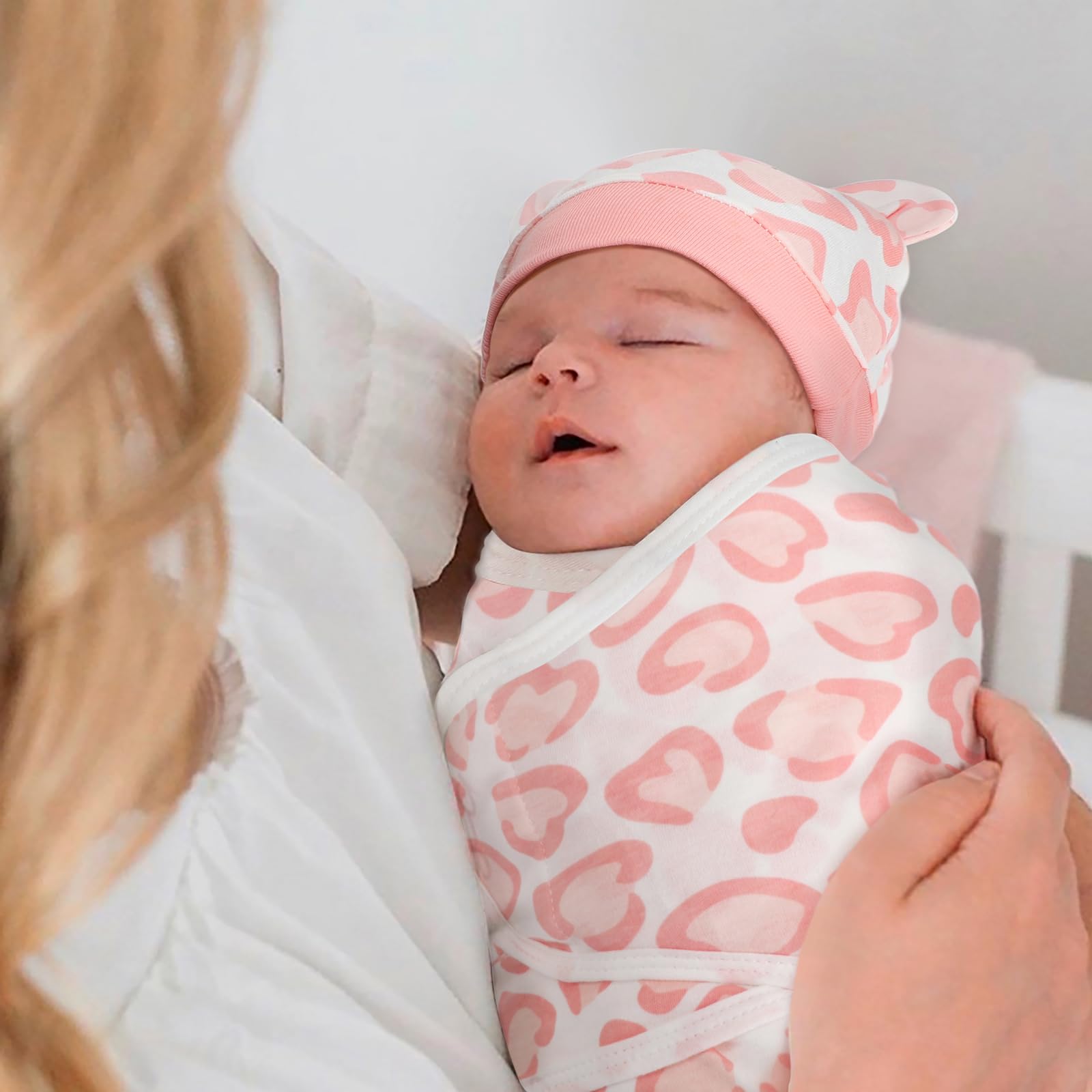 AQOKKA swaddle with adjustable wings demonstrated for customizable snugness.