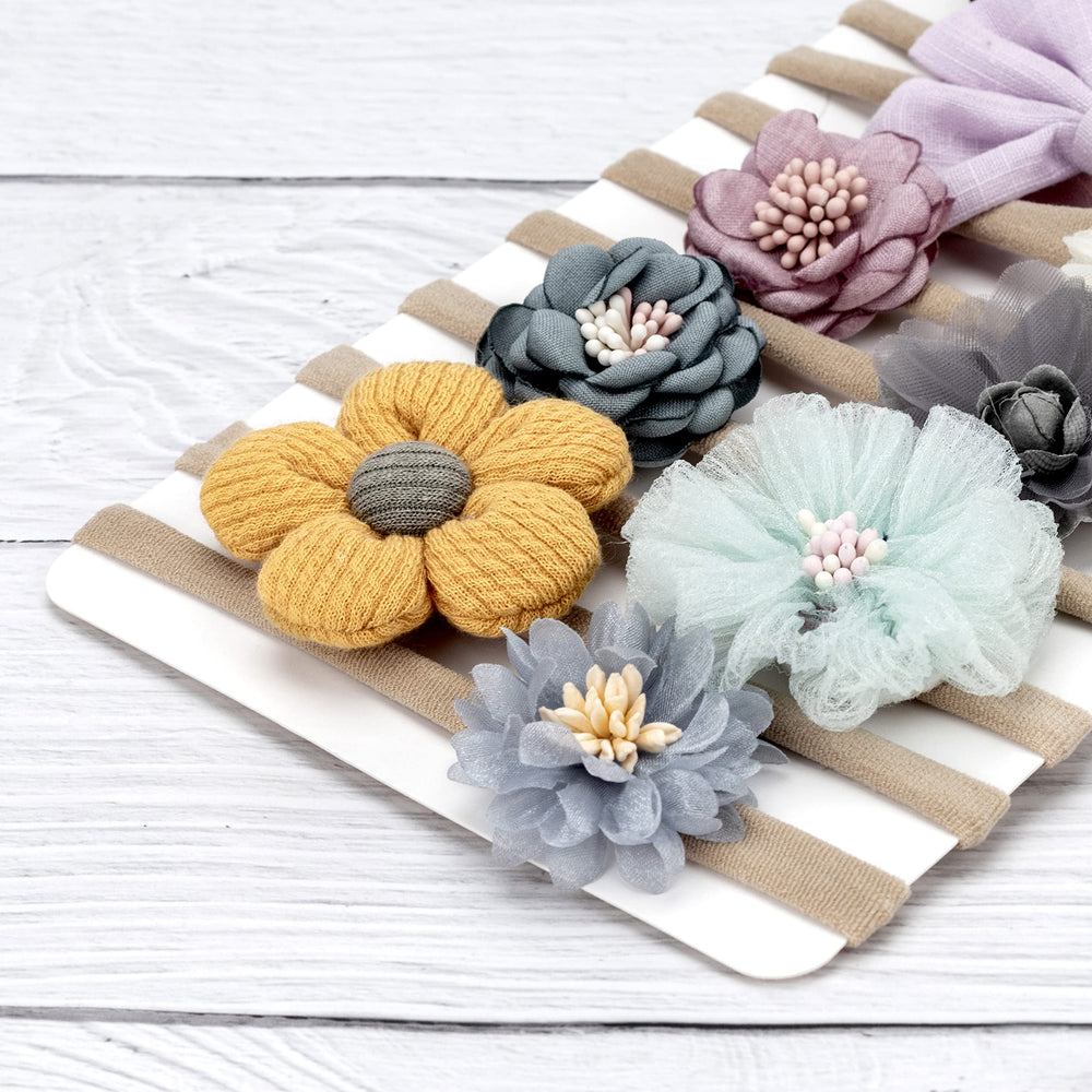 AQOKKA newborn photography accessory headband helps capture adorable milestone moments.