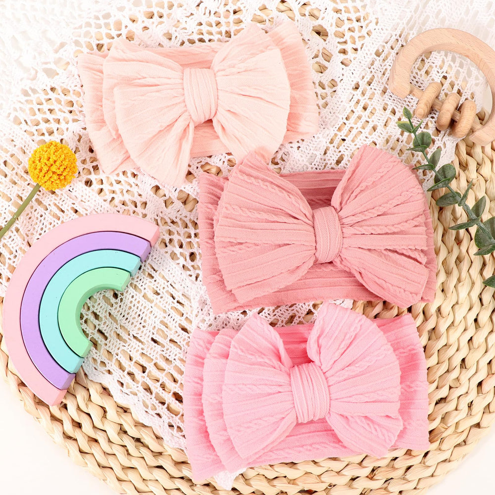 AQOKKA headband styled for photoshoots, enhancing baby smiles and outfits.