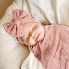 AQOKKA swaddle close-up showing soft, breathable texture.