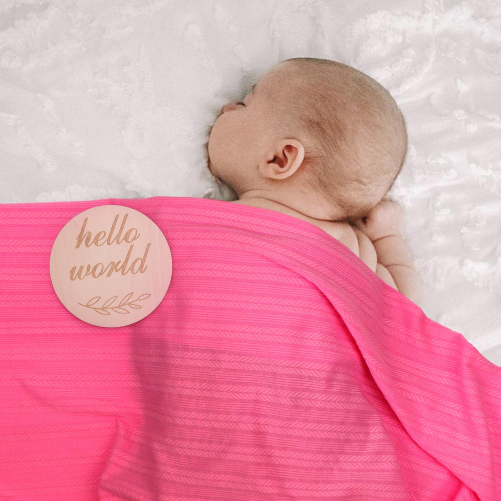 AQOKKA swaddle demonstrates gentle, comfortable positioning for daily wear or photos