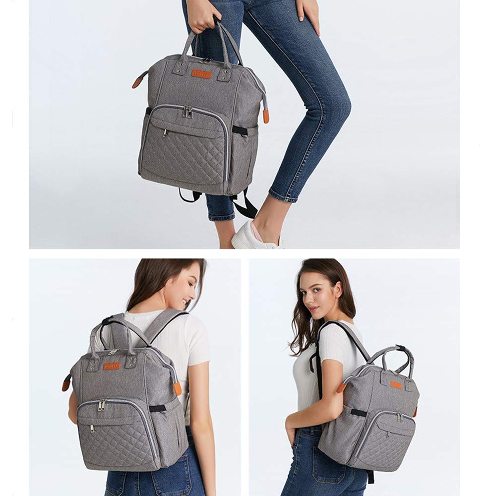 Spacious interior of Armbq bag holds diapers, clothes, and toys.