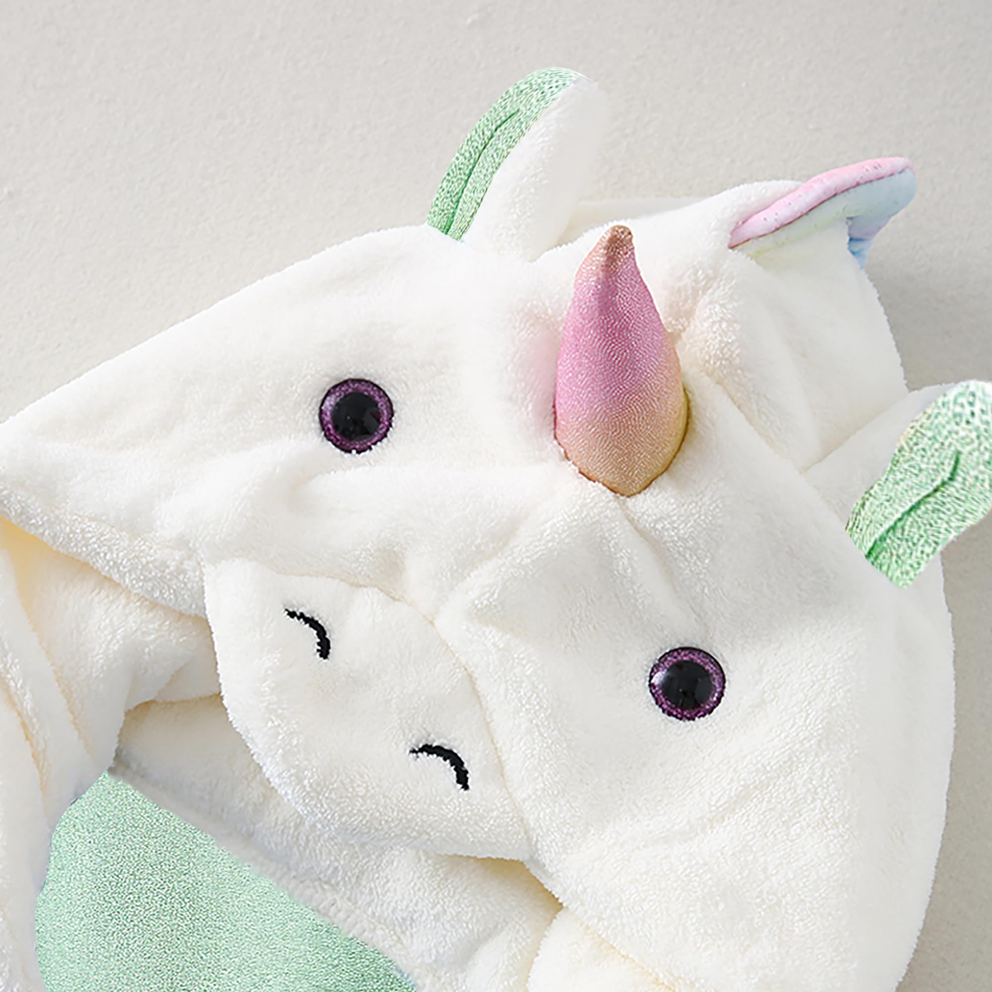 ARNUAETY water-absorbent towel wrap keeps kids cozy after swimming.