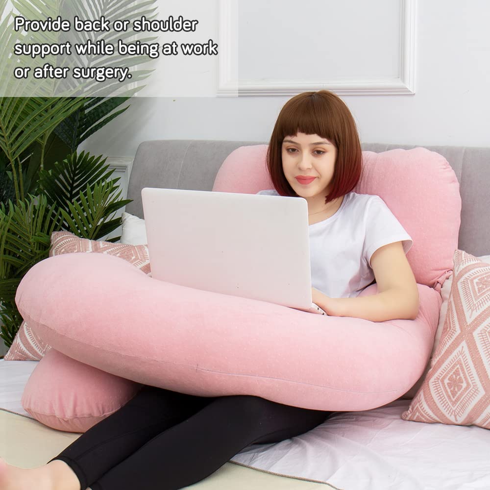 AS AWESLING maternity pillow supports mom-to-be in bed.