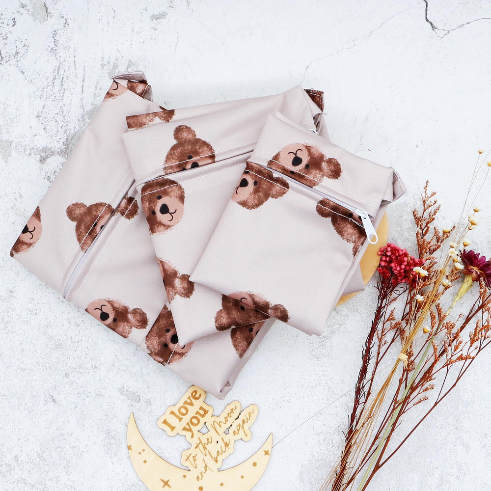 Asenappy waterproof cloth diaper bag protects contents during travel and outings.