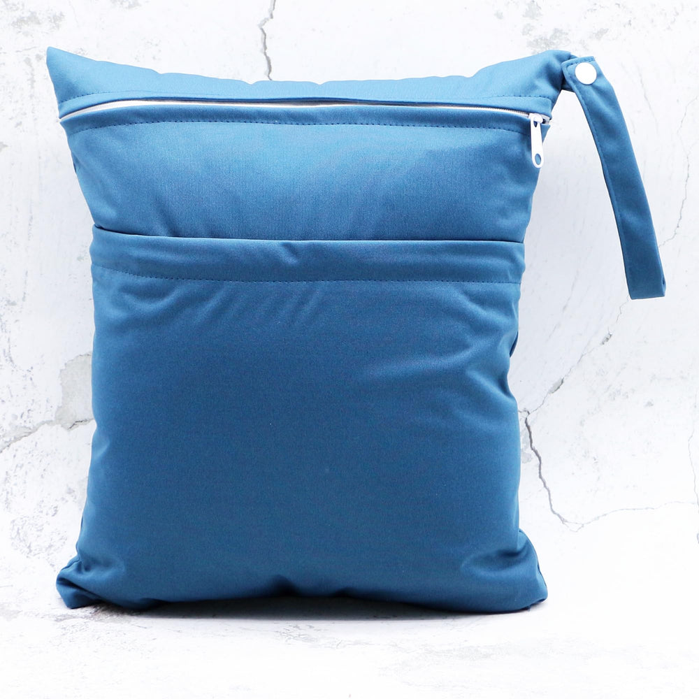 Asenappy bag stores swimsuits and wet clothes for beach days.