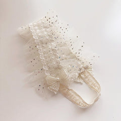 Asphinien turban-style lace headband delivers chic, comfortable infant styling