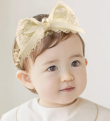 Asphinien Ivory Lace Headband with bow closeup for a refined newborn look