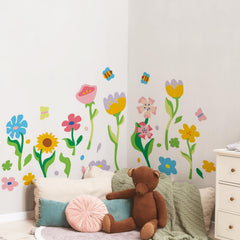 Astrkiz Memphis abstract wall decal with a large flower adds playful color to the playroom.