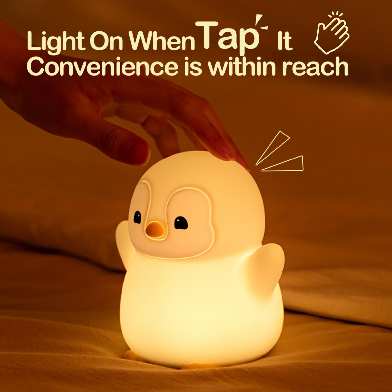 ATSUI Happy Penguin Night Light on table with touch control for easy brightness adjustment.