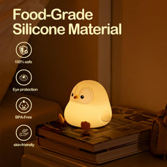 ATSUI Penguin Night Light off state resting on a desk surface.