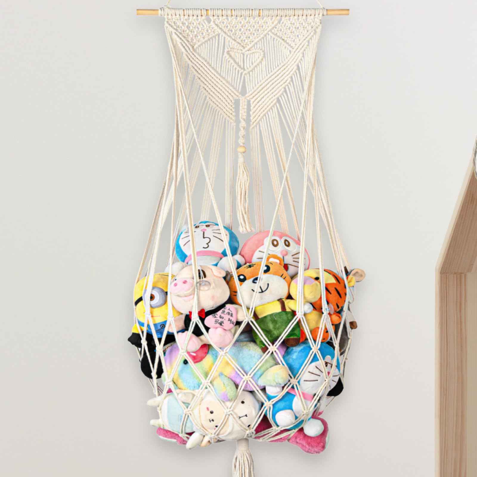 Aufee stuffed animal storage hammock in corner setup saves floor space for toys.