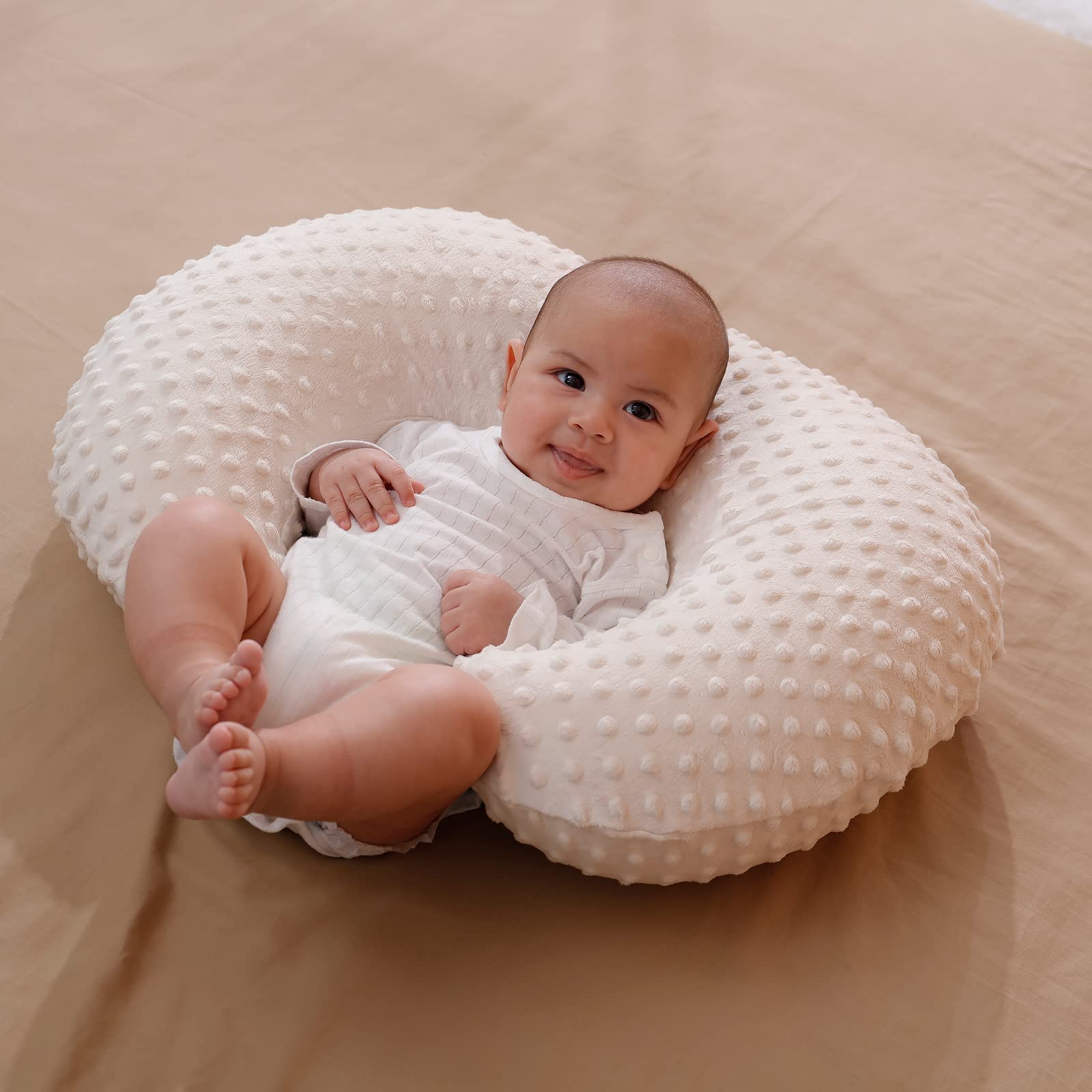 Aullar pillow doubles as sitting support for early play.