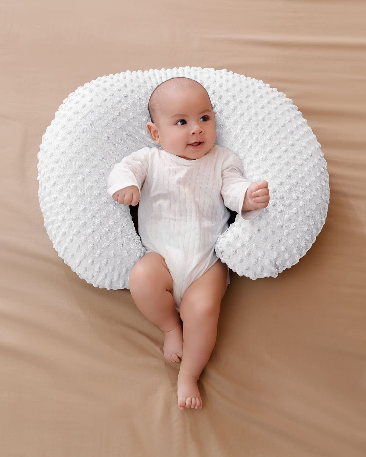 Aullar nursing pillow assists early sitting with a stable angle and support.