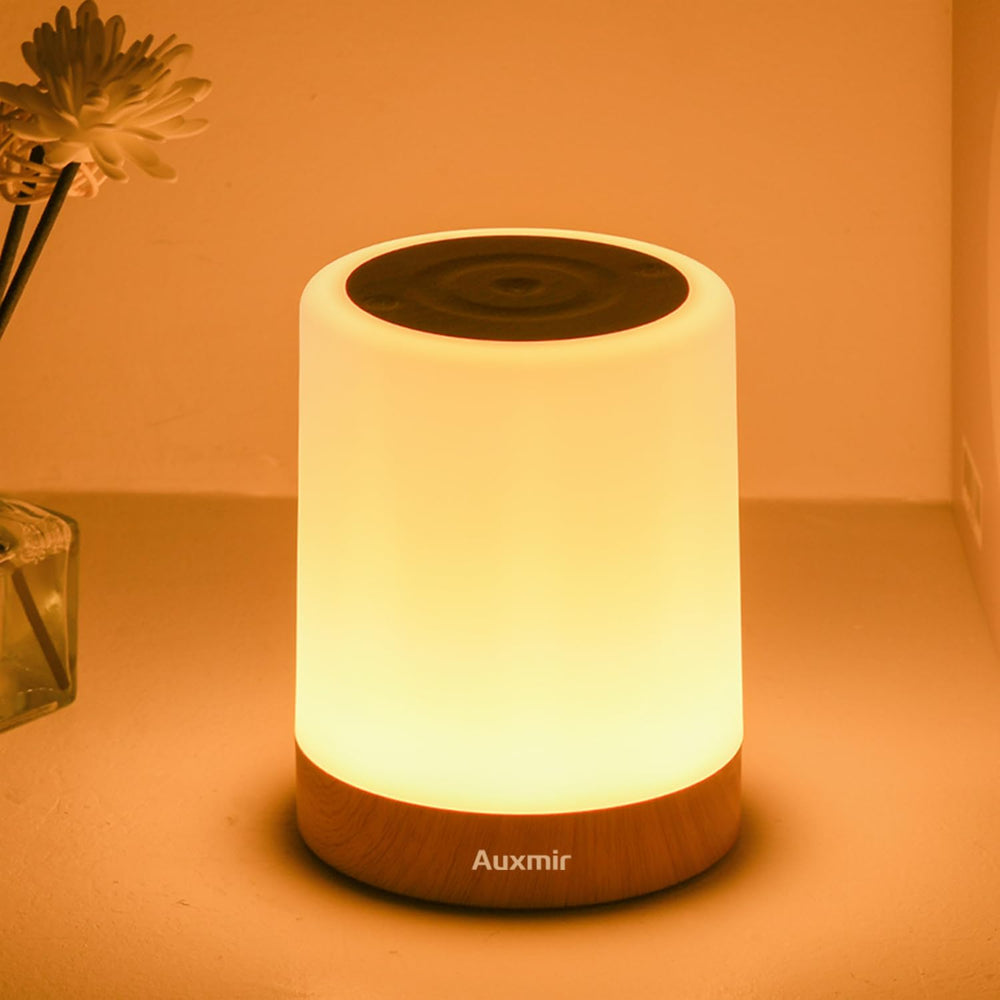 Auxmir night light on a bedside table with dimmable touch control for a calming nursery