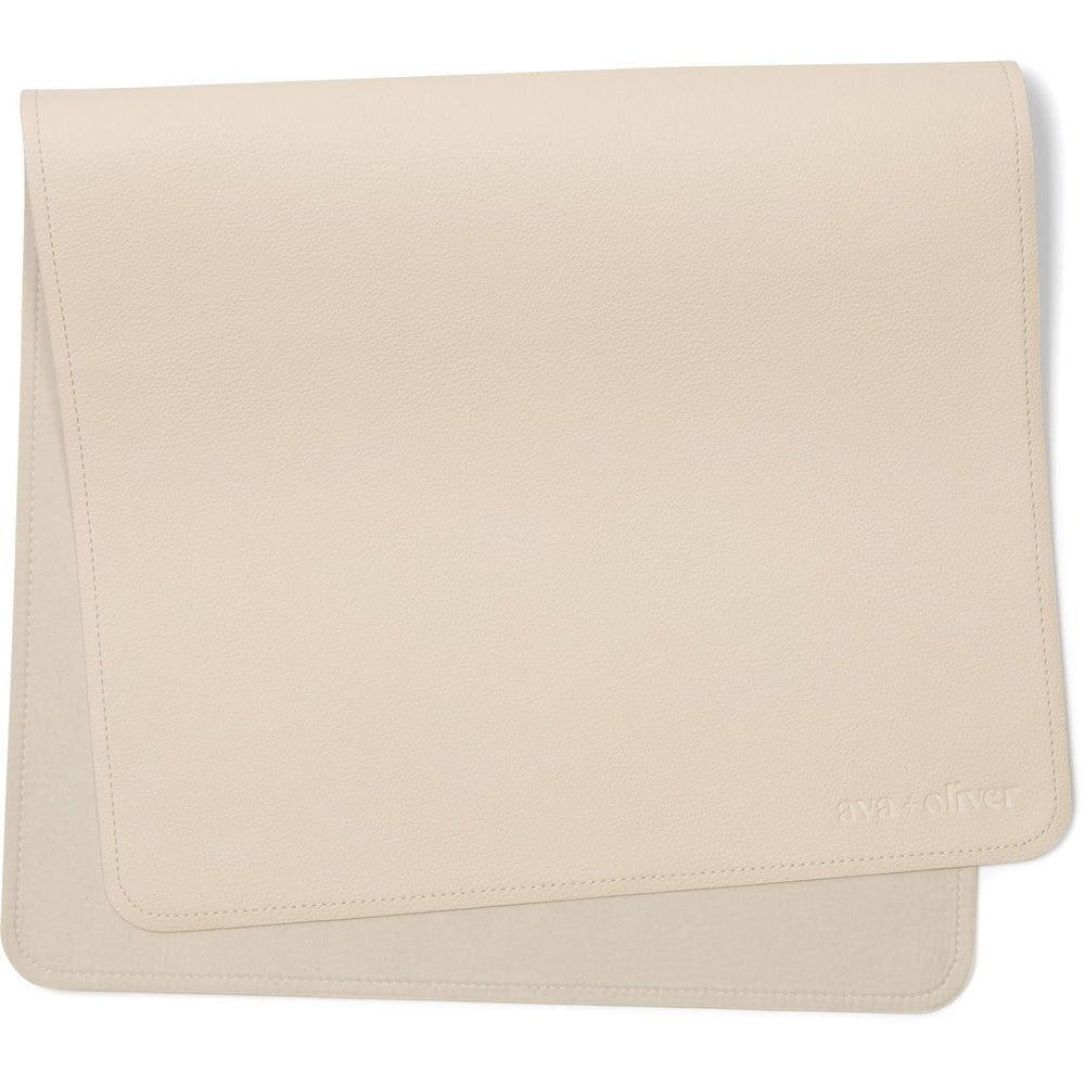 AVA + OLIVER vegan leather changing mat in cream, folded for easy storage