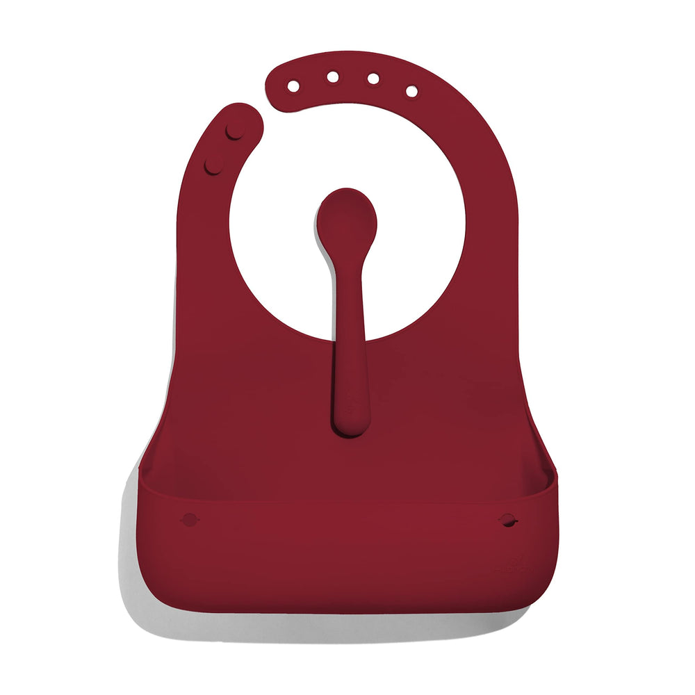Avanchy silicone baby bib with roll-and-go design and included spoon for mess-free meals.