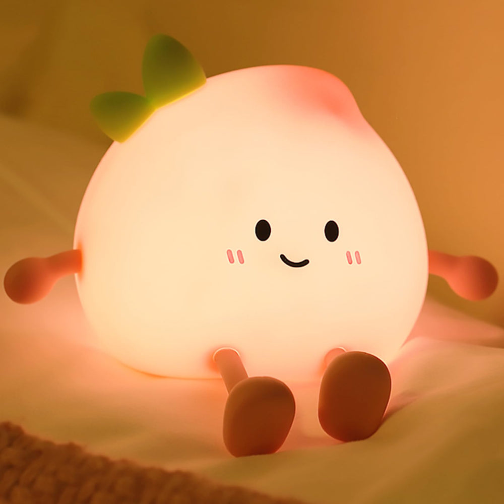 AVEKI peach night light with smiling face for cozy bedtime.