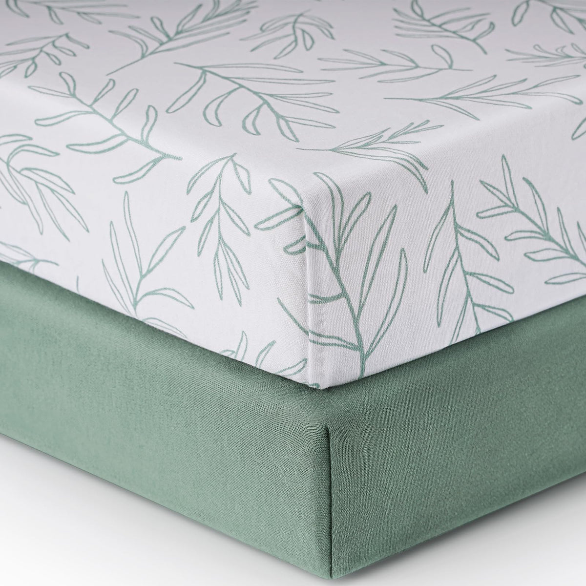 Babebay sage green fitted crib sheet in soft jersey cotton for gentle sleep.