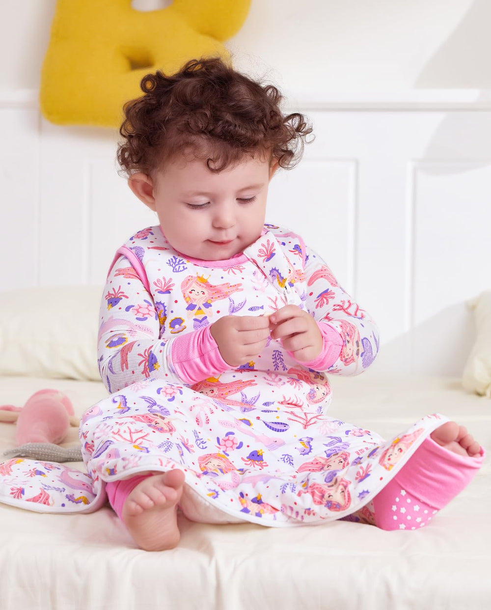 Babee Reshinee newborn transition sleep sack supports independent sleep.