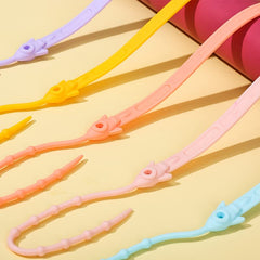 Orange Babeine straps provide colorful organization for travel and feeding.
