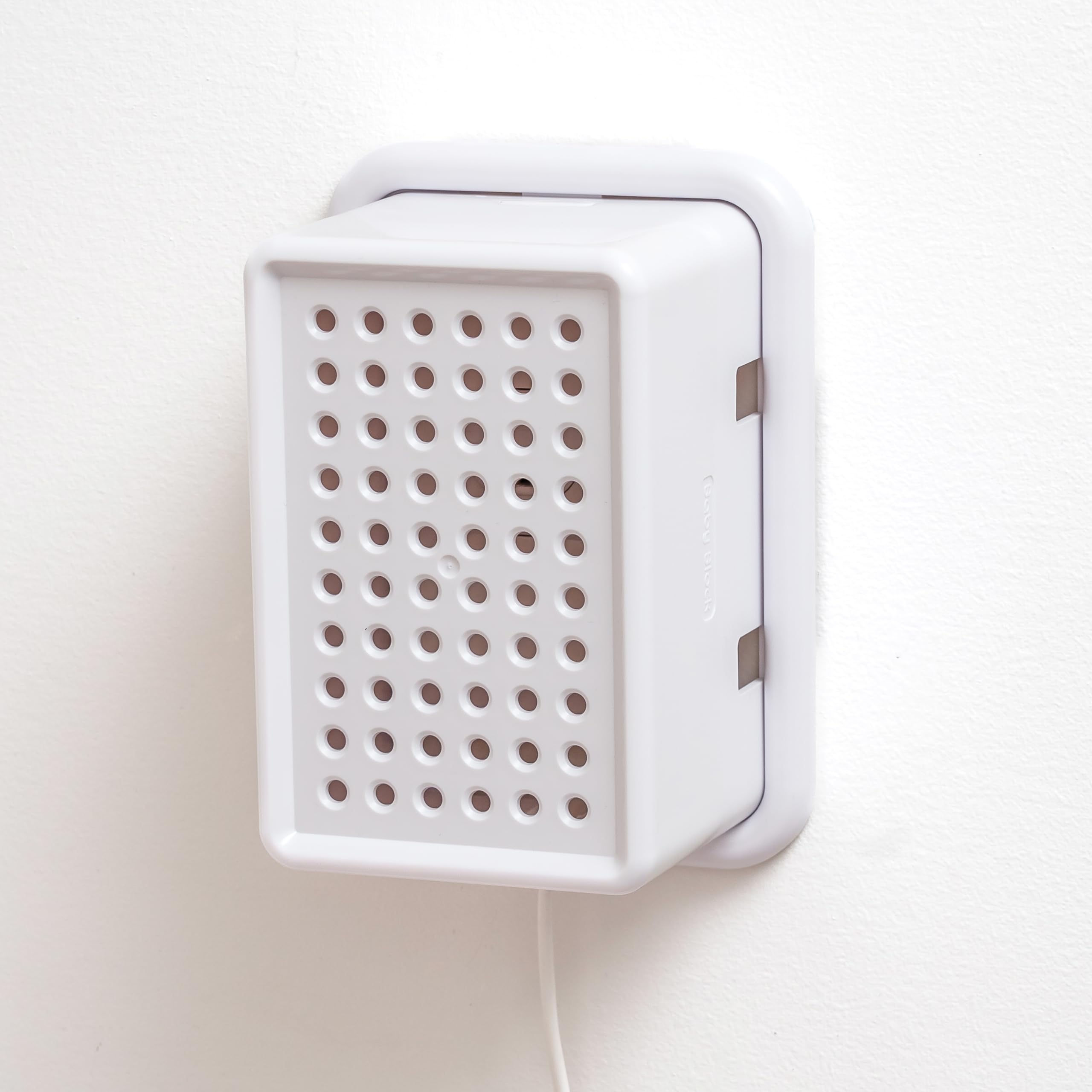 Baby Block oversized outlet cover box with wide adapters protects children while accommodating bulky plugs.