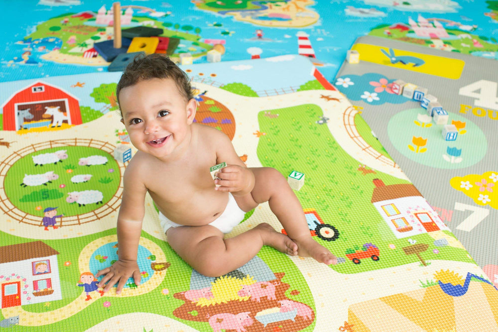 Baby Care Play Mat Kids Playing captures joyful exploration on soft surface.
