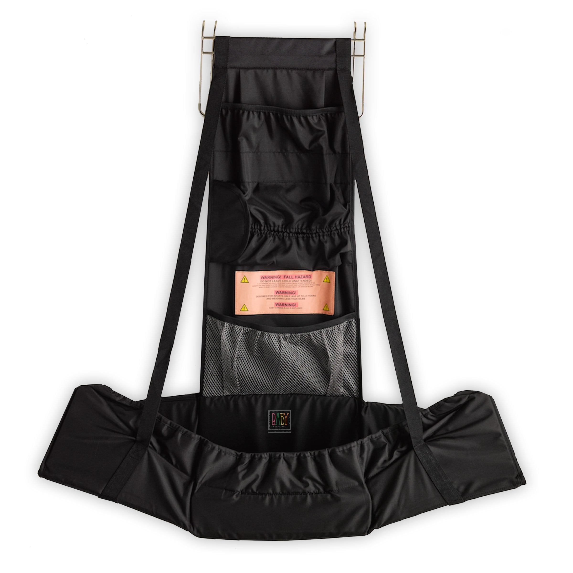 Baby Change-N-Go travel station shown over a door for private diaper changes.