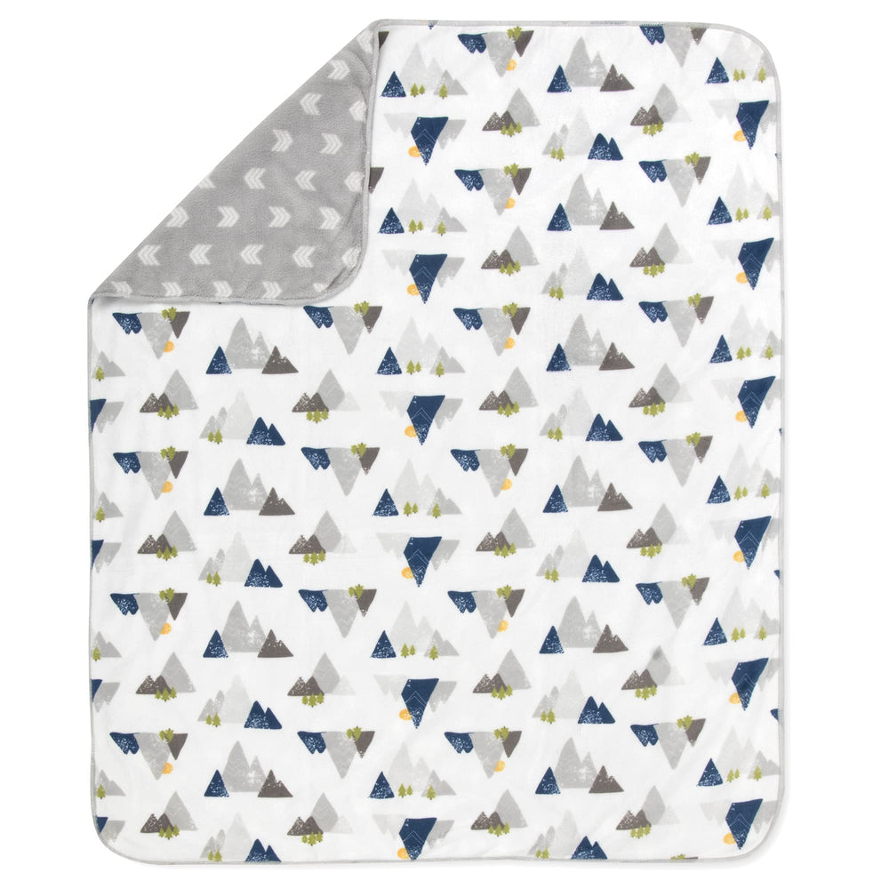 Baby Essentials Sherpa blanket reversible design features mountains and arrows for neutral decor