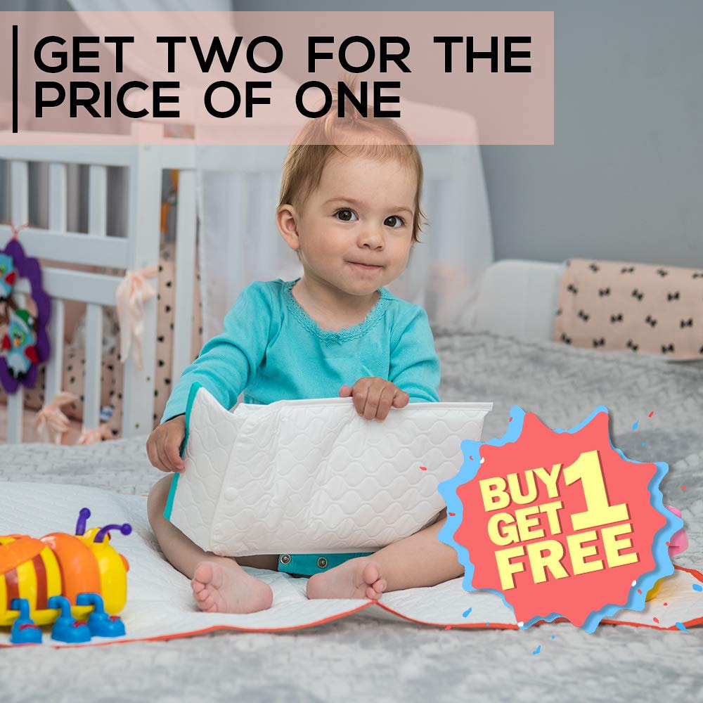 BABY LOOVI changing pad in use on table for quick diaper changes.