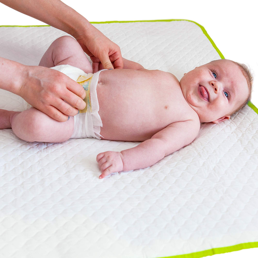 Baby Loovi portable changing pad folded inside the storage bag for travel convenience.