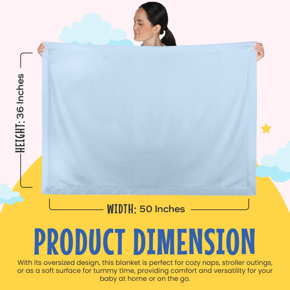 Baby Morgan blue blanket styled for swaddling and tummy time.