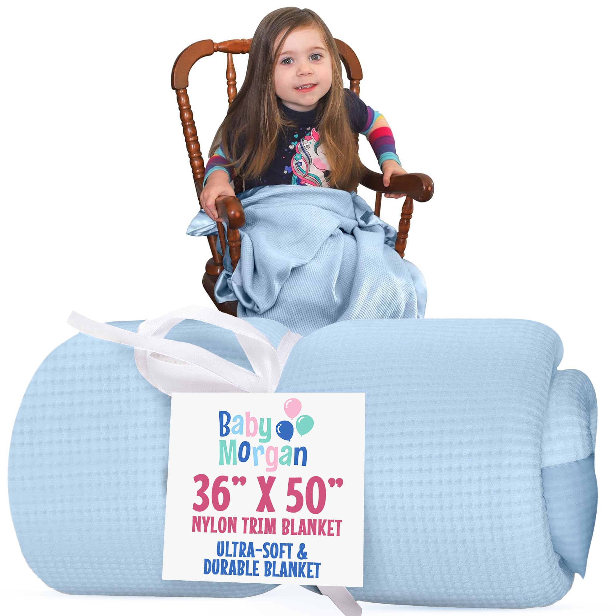 Baby Morgan blue waffle blanket shown in a cozy crib setup for soft naps.