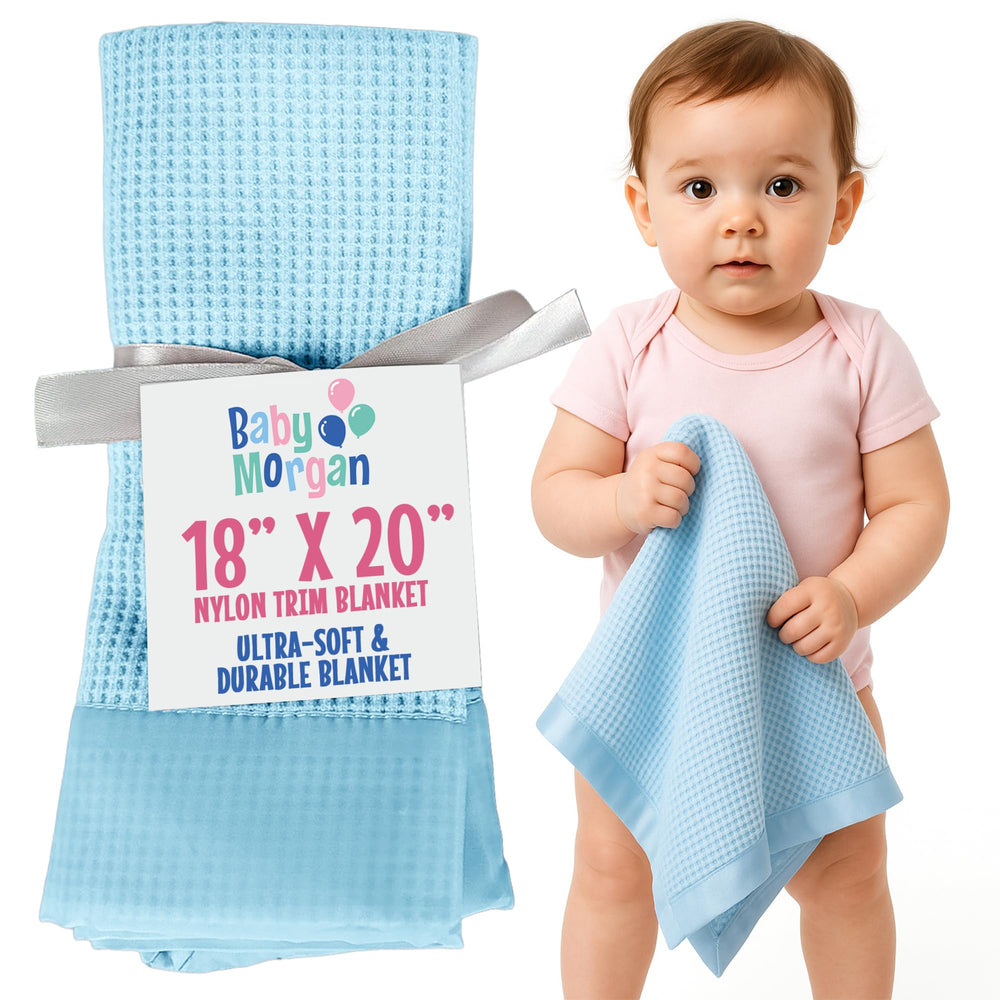 Baby Morgan blue waffle knit blanket with nylon trim offers cozy warmth for baby cuddles.
