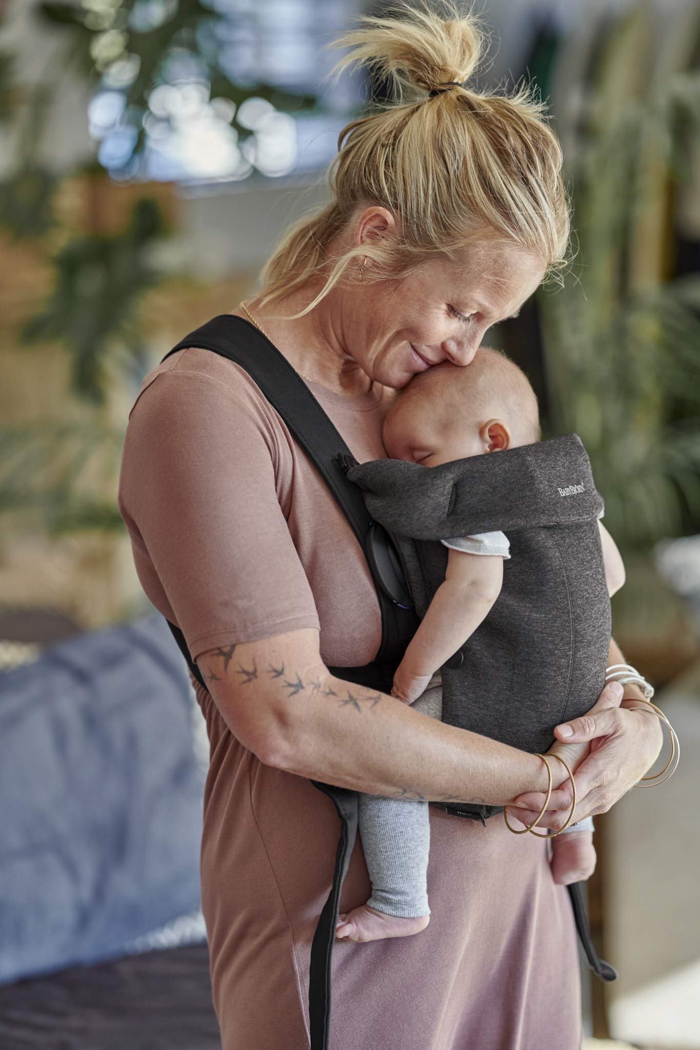 BabyBjörn Baby Carrier Mini suitable for babies up to 24 lbs, enabling early bonding.