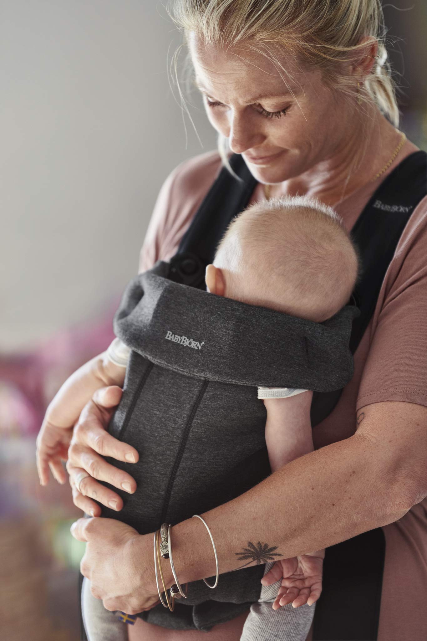 BabyBjörn Baby Carrier Mini compact soft design shown for easy, comfortable outings.