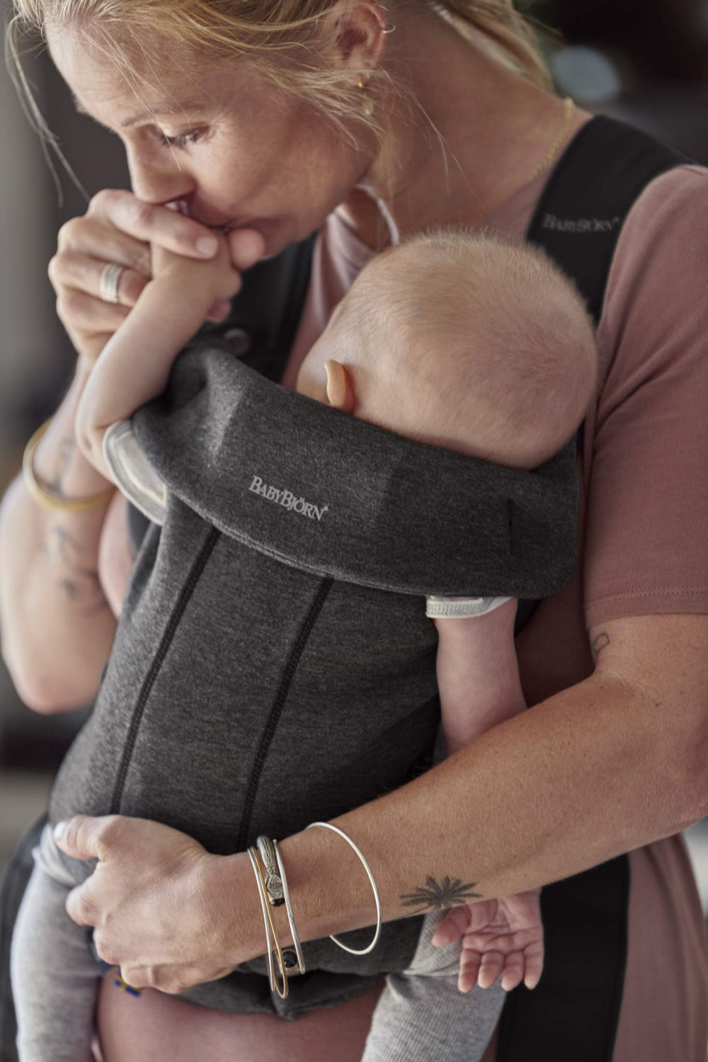 BabyBjörn Baby Carrier Mini front-facing-out in 3D jersey for curious babies exploring safely.