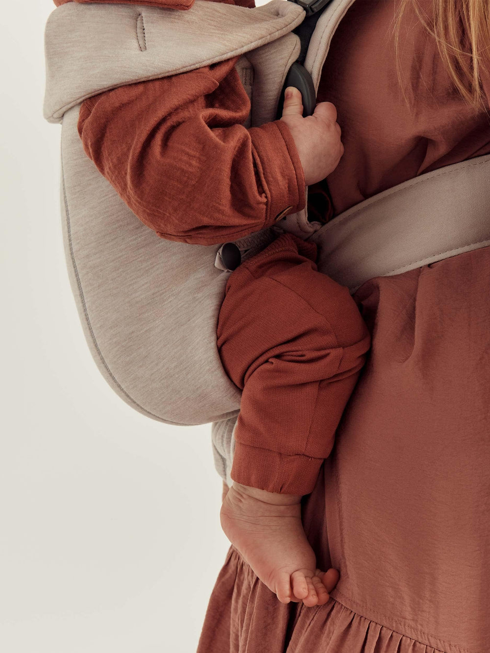 Compact size range of Baby Björn Carrier Mini for growing babies