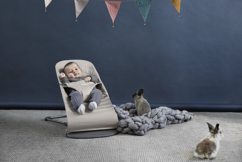 BabyBjörn Bouncer Bliss folded image shows flat storage for travel.