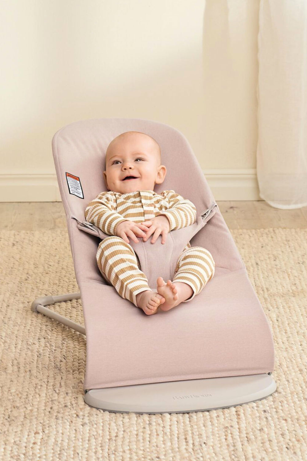 BabyBjörn Bouncer Bliss harness on, safety harness for secure bouncer use.