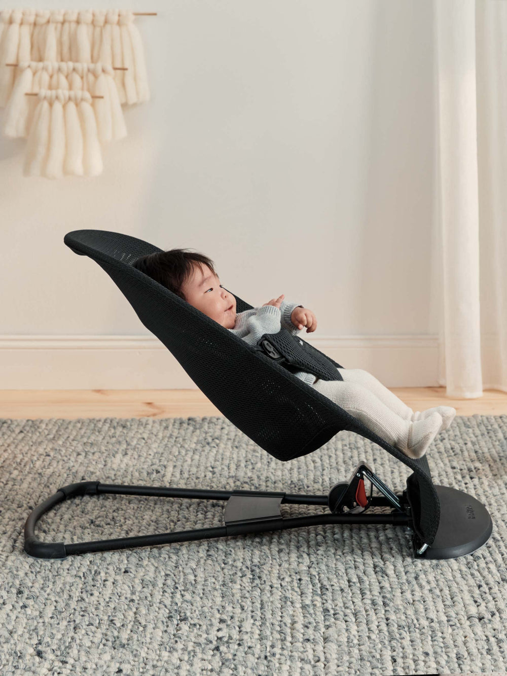 Lightweight BabyBjörn Bouncer Bliss ready for moving between rooms.