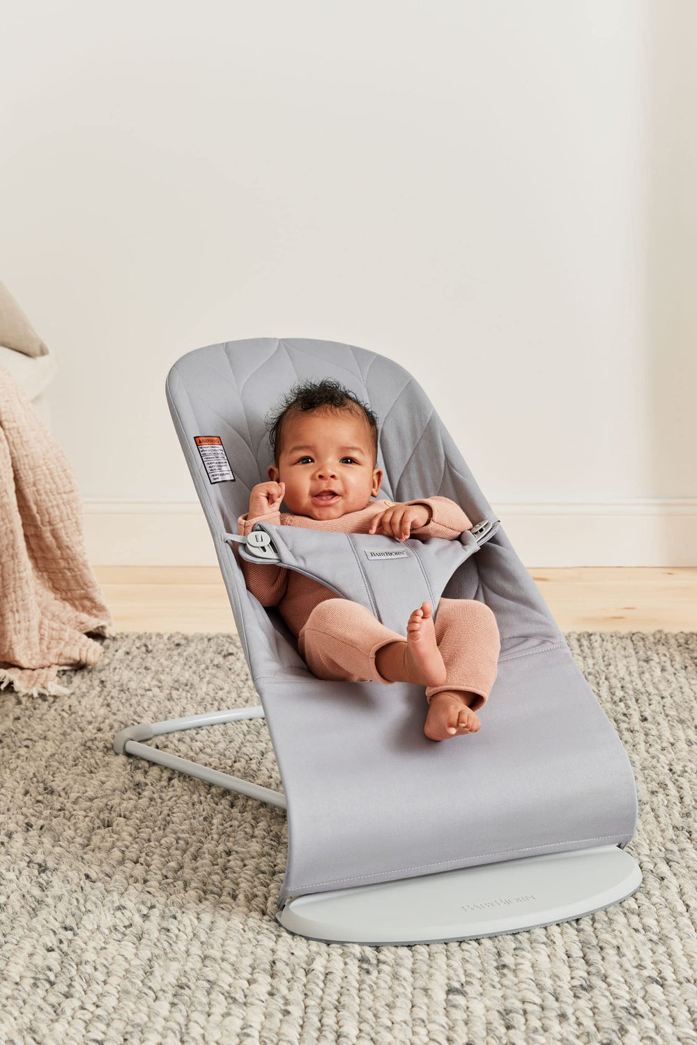 BabyBjörn Bouncer Bliss petal quilt pattern highlights gentle design and cozy aesthetics.